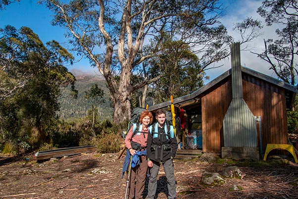Christine and James with their backpacks at the Narcissus Ranger hut, Lake St Clair, Tasmania