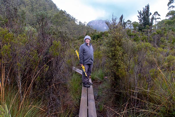 Graham standing on the boardwalk outside the Lake Vera Hut