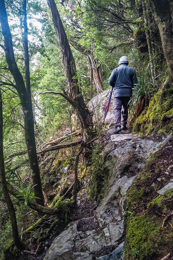 Graham walking the narrow track that clings to the side of Lake Vera