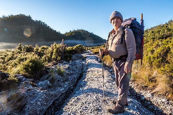 Early morning on Rumney Plain. Graham standing on the white granite track.