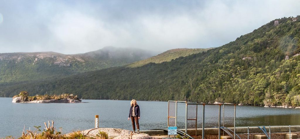 Christine standing on the Lake Margaret dam wall in west Tasmania