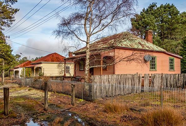 Three circa 1900 wooden workers cottage in the abandoned hydro village at lake Margaret in Tasmanias