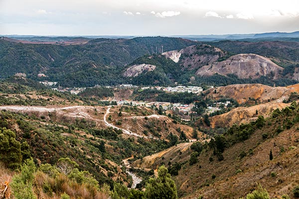 Looking down over Queenstown from the highway to Derwent Bridge shows a stark landscape with little vegetation.