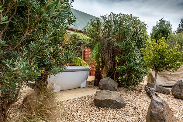 Outdoor spa in front of Fon Hock cottage accommodation near Derby in Tasmania