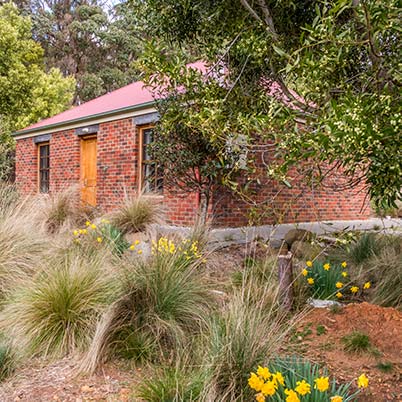 The brick Ah Moy two-bedroom cottage is better suited to two couples or a small family of three.