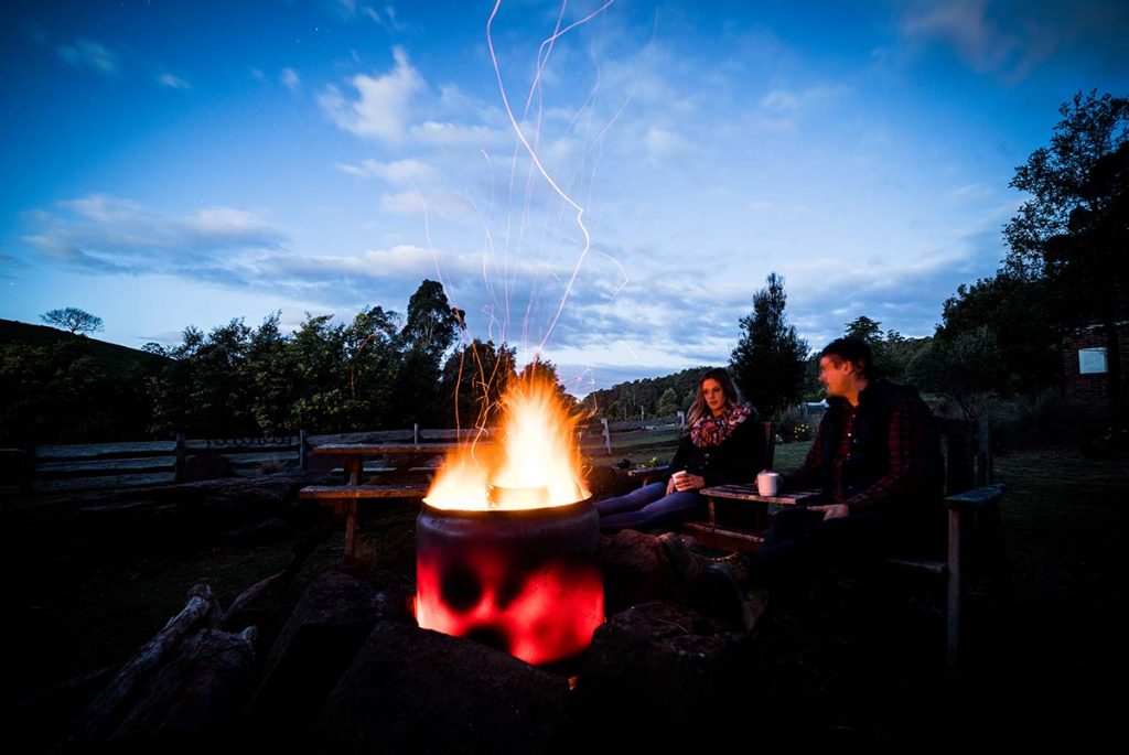 Romantic getaway at Tin Dragon Cottages gazing into the fire pot.