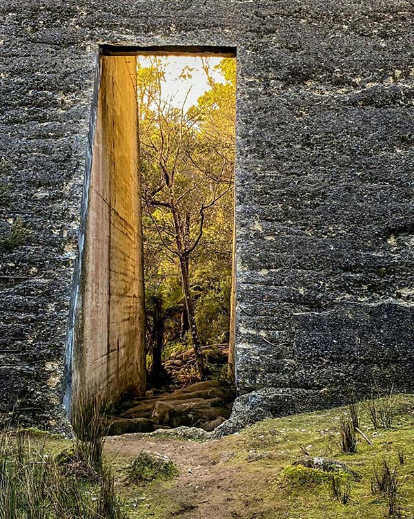 Looking through the hole in the face of the Mount Paris dam wall in North East Tasmania: our road trip.
