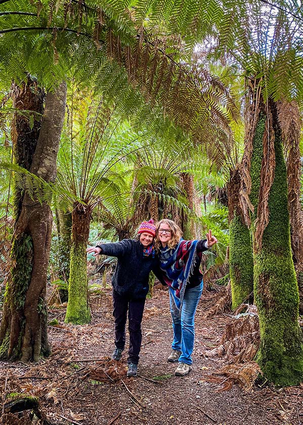Two women standing on a path in the Myrtle Forest, North East Tasmania.