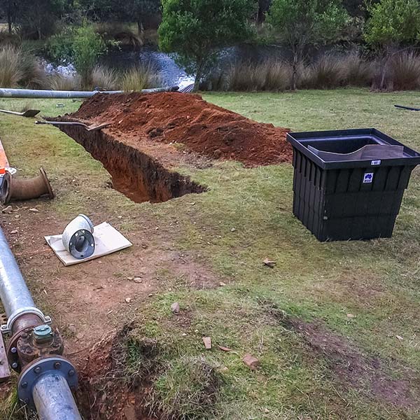 Trench in the ground leading to a dam is to accommodate the micro hydro tail race.