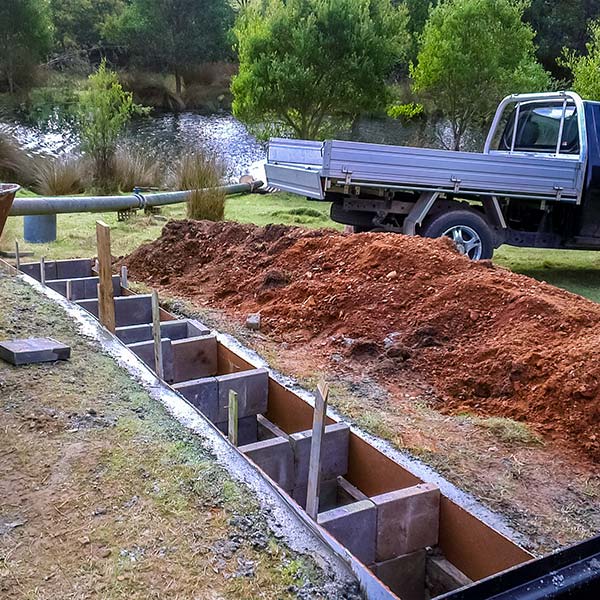 Section being boxed prior to laying the cement for the micro hydro tail race.