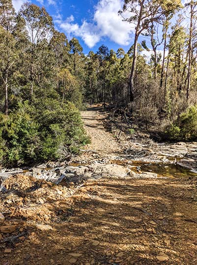 This is a view of the river crossing, showing large rocks and low-level of water in the river.