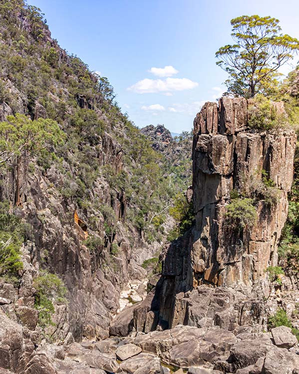 Looking downstream from the waterfall, the river snakes through a deep dolerite ravine.