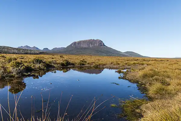 Mount Pelion and a deep blue sky reflected in a tarn.