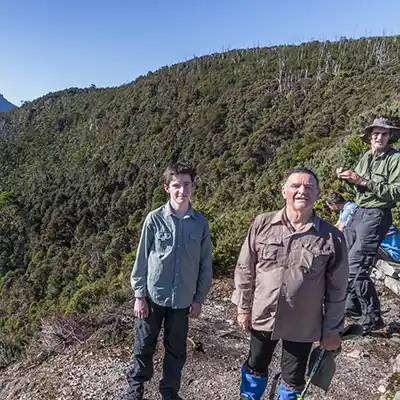 James and Graham standing on the ledge of the Forth Valley Lookout on the third day of the Overland Track walk.