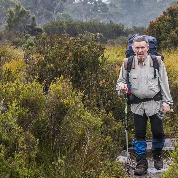 Graham is approaching the last swing bridge on the Overland Track.