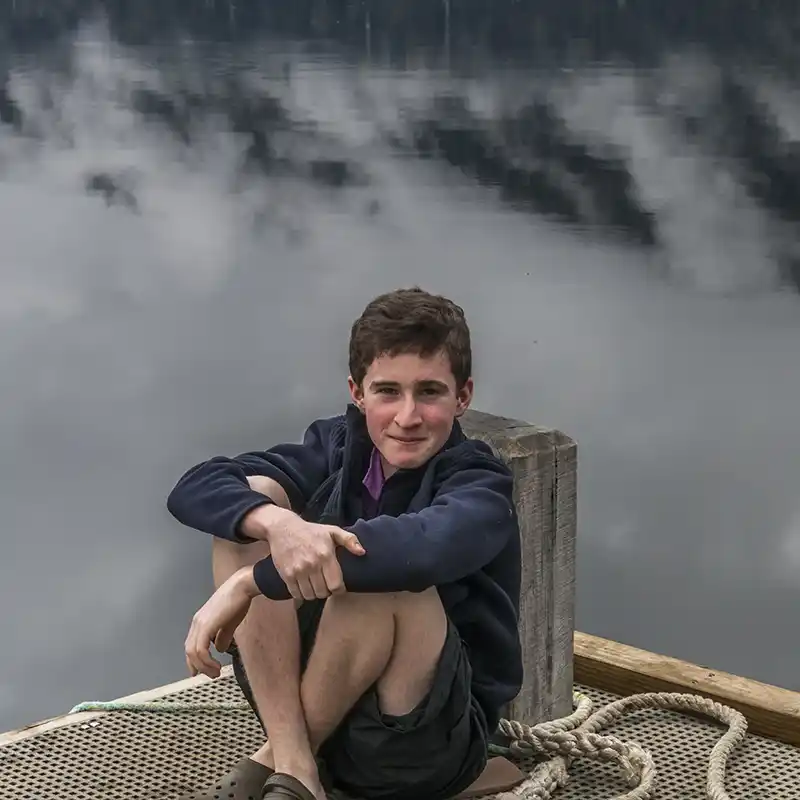 James sitting on the Narcissus jetty
