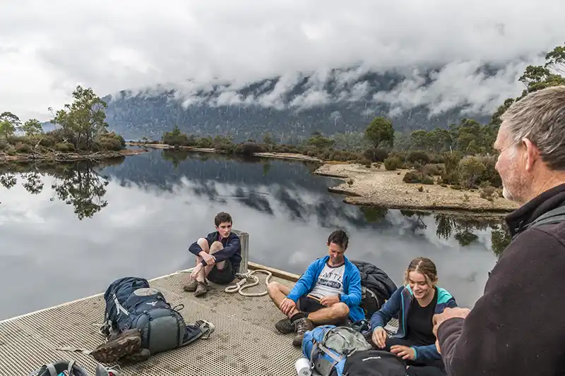 Graham (standing), James (sitting) and a father and daughter (sitting) on the jetty at Narcissus.