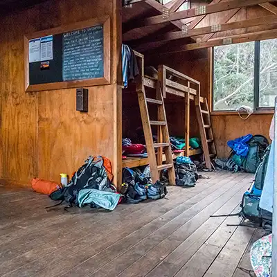 Isnide the (old) Waterfall Valley hut, showing timber sleeping  platforms.