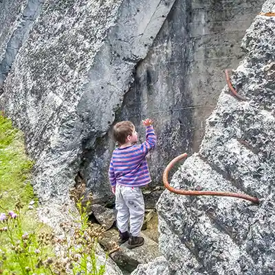 A young boy stans in the entrance of one of the My Paris dam wall holes - on the upstream side of the dam.