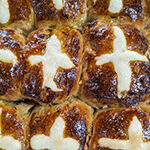 Close up of freshly baked hot cross buns