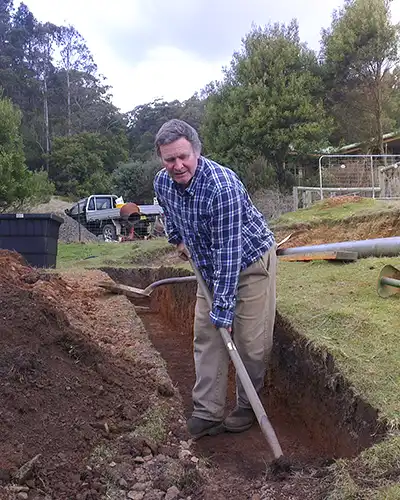 Digging the last length of trench by hand!