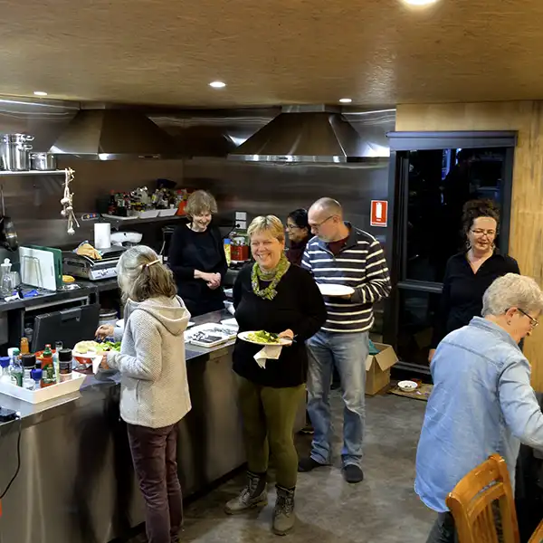 Guests are serving food onto their plates.