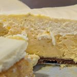 Cheesecake profile with a slice being removed.