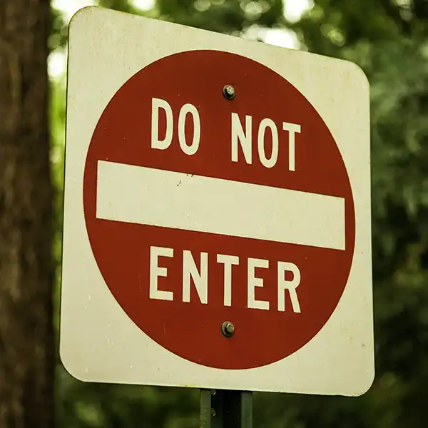 A red on white road sign says, do not enter