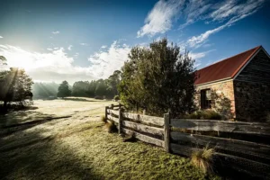 Chintock stone cottage exterior looking out over a frosty paddock in the early morning.